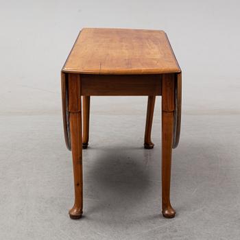 An end of the 19th Century mahogany drop leaf table.