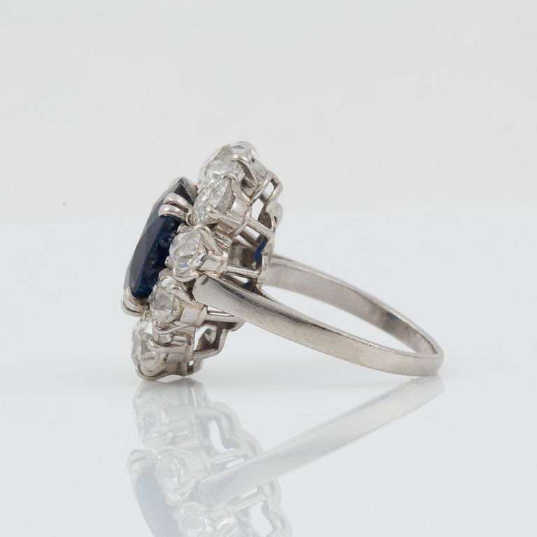 An untreated sapphire, circa 4.00 cts, and diamond ring. Signed Boucheron.