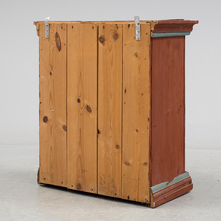 a painted cabinet dated 1828.
