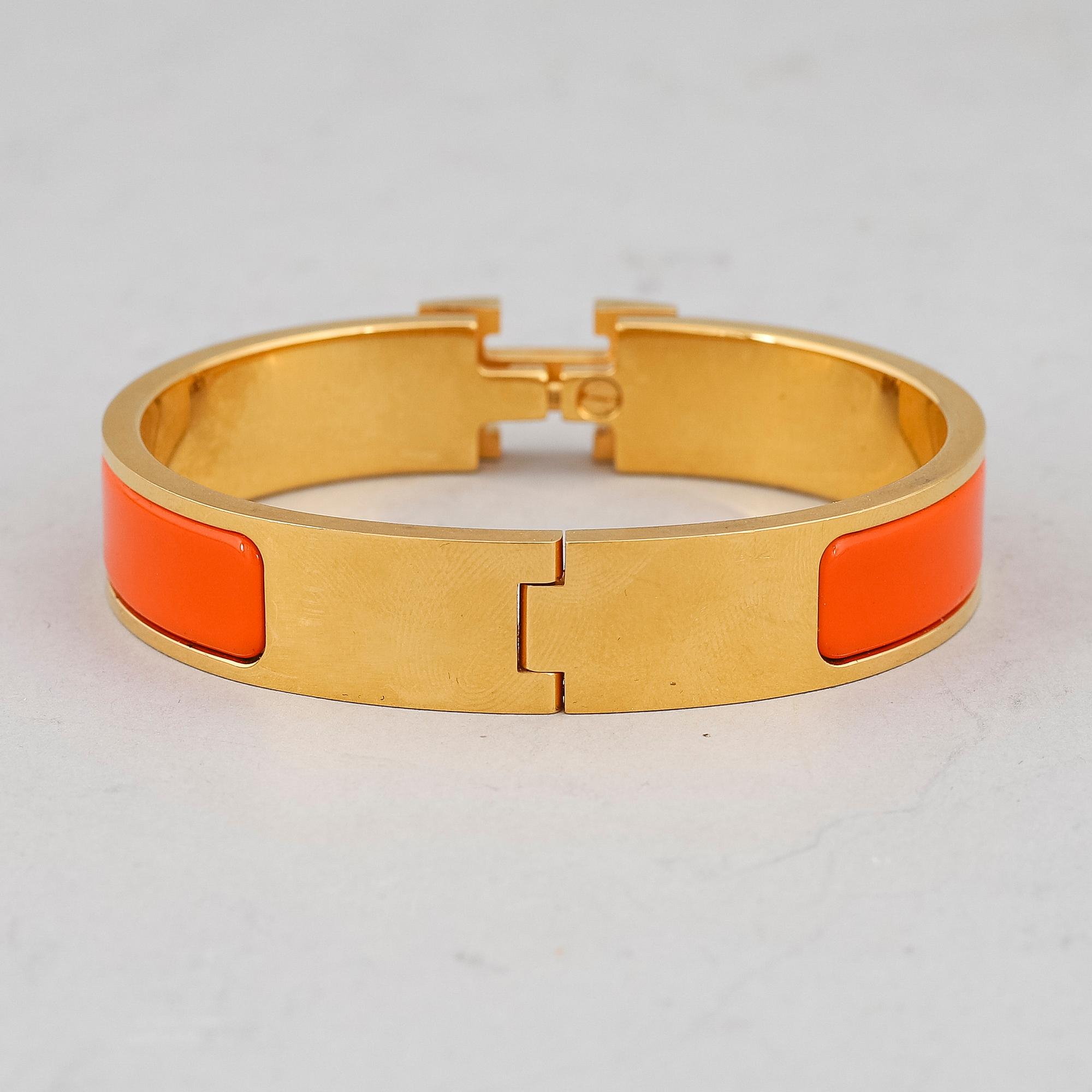 HERMÈS, a 'Clic H' bangle.