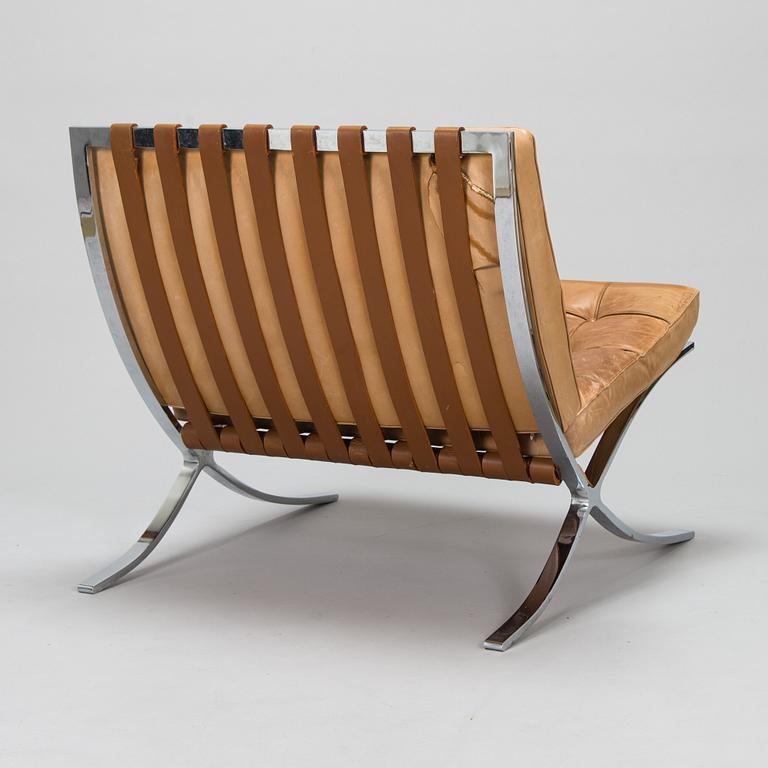 A Ludwig Mies van der Rohe "Barcelona" chair.