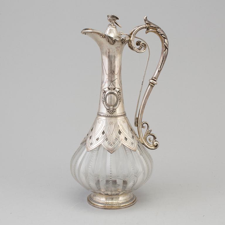 A first half of the 20th century silver and glass wine jug.