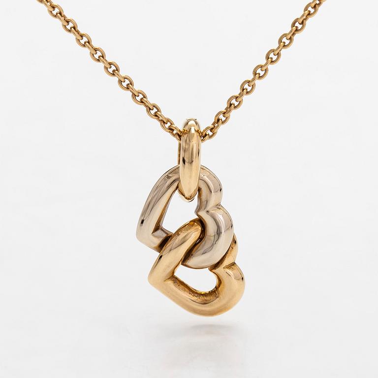 Cartier, an 18K gold necklace, with a double heart pendant.