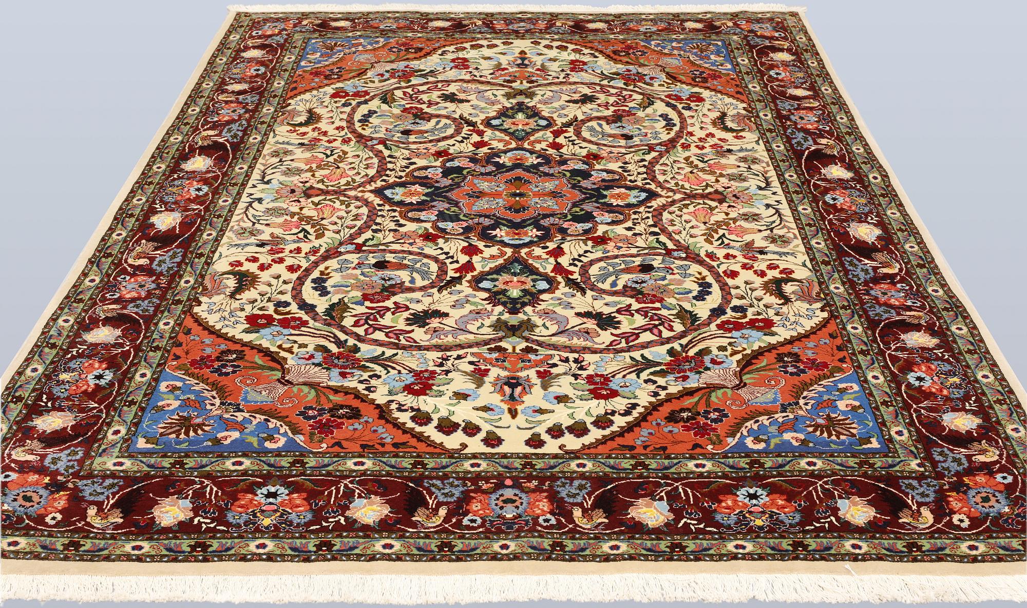 A part silk Tabriz rug, so-called 50 Raj, approx. 242 x 178 cm.