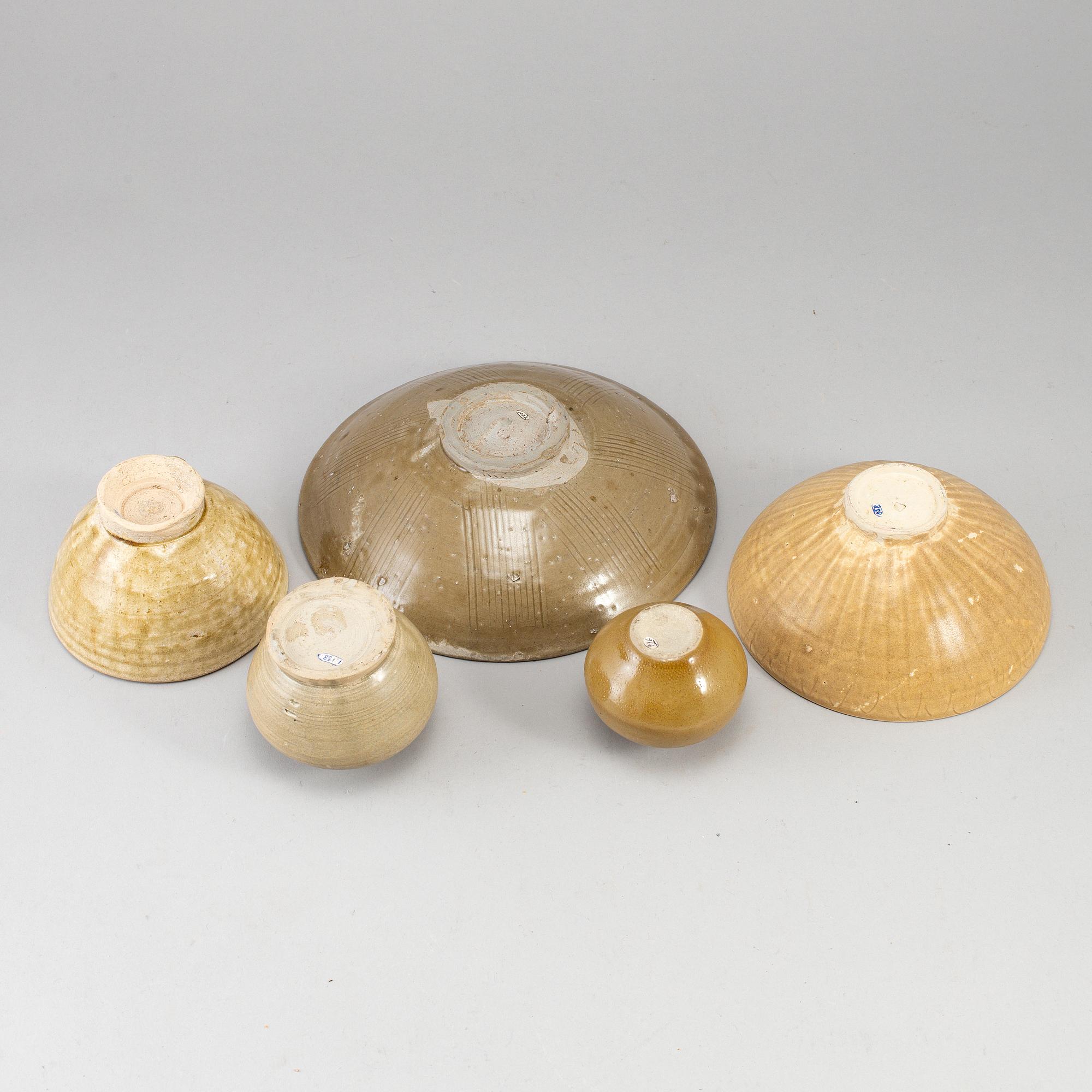A group of five brownish glazed vessels, South East Asia, Songstyle, 20th Century.