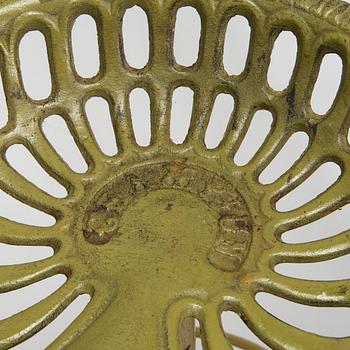 Four bar stools, painted cast iron, partly from the early 20th century.
