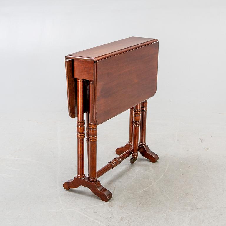 A 20th century English mahogany folding table.
