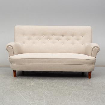 A 'Hemmakväll' sofa by Carl Malmsten.