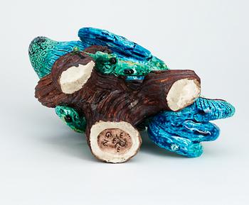 A Gunnar Nylund stoneware figure of a peacock.