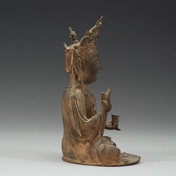 A seated bronze sculpture of Guanyin, late Ming dynasty.