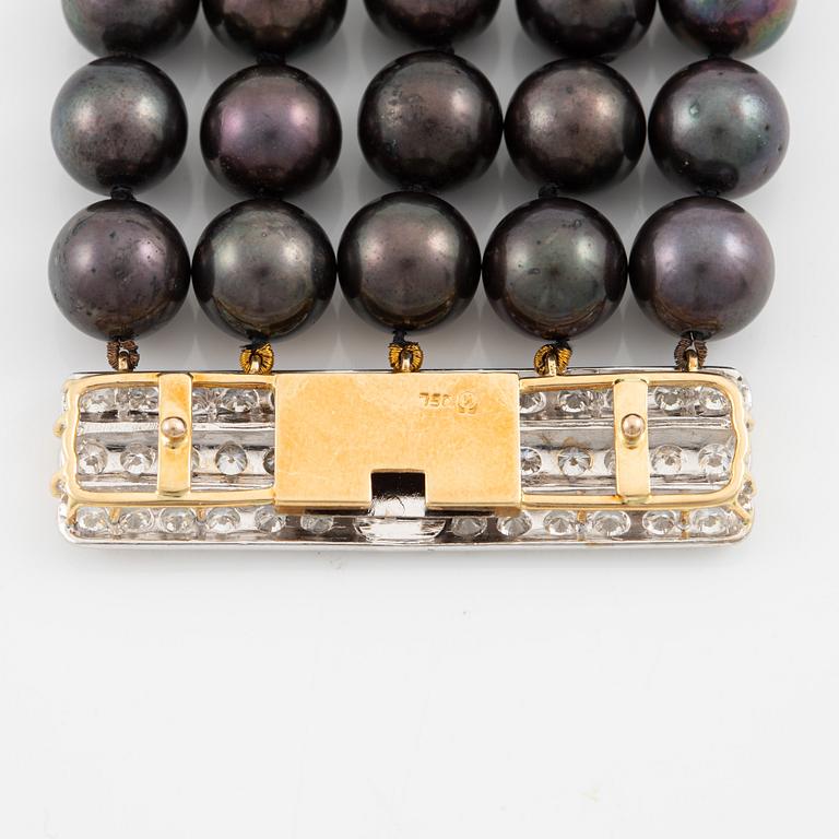 Necklace, five-row with cultured black pearls, 18K gold and white gold with brilliant-cut diamonds.