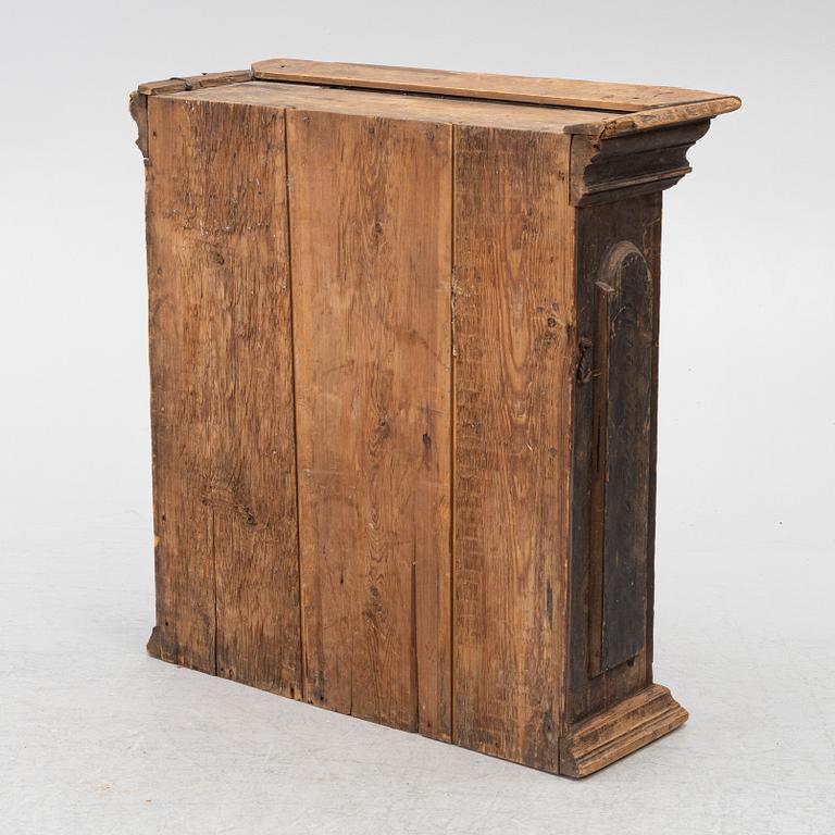 A polychrome-painted folk art hanging cabinet from Järvsö, Sweden, early 19th century.