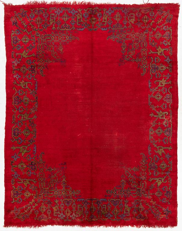 An antique Ushak carpet, West Anatolia, approx. 327 x 250.