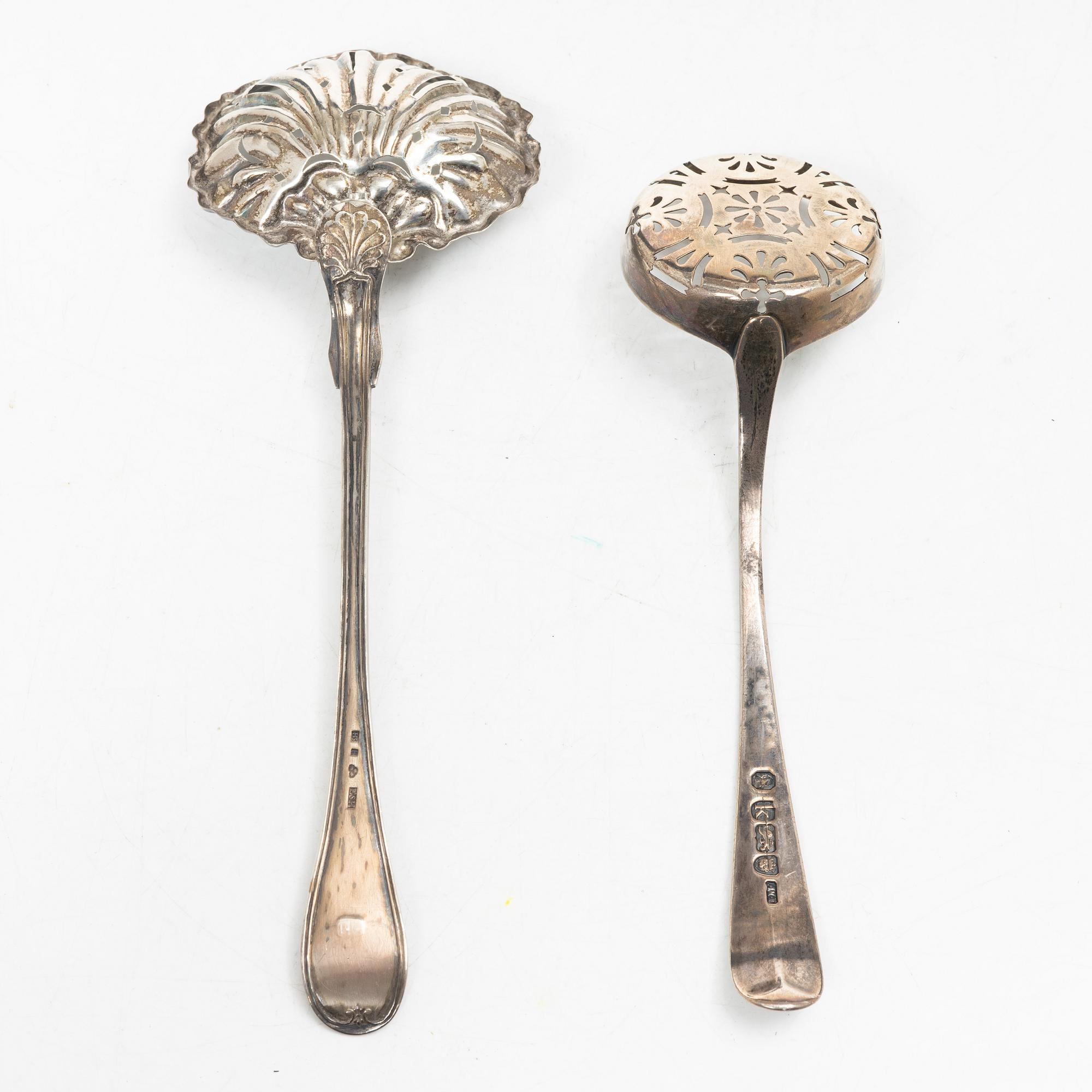 Two pierced silver bowls and two sugar spoons, including Sweden and Endland, 20th century.