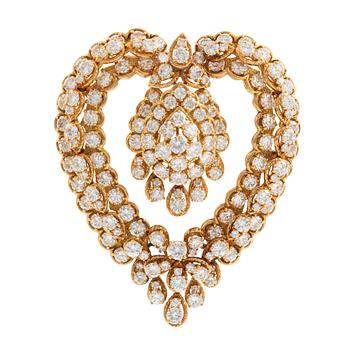 524. Van Cleef & Arpels brosch/hänge 18K guld med runda briljantslipade diamanter.