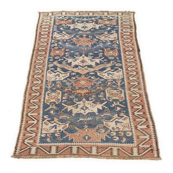An oriental rug, c. 200 x 115 cm.