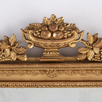A pair of Swedish Empire mirror wall sconces, first half of the 19th century.