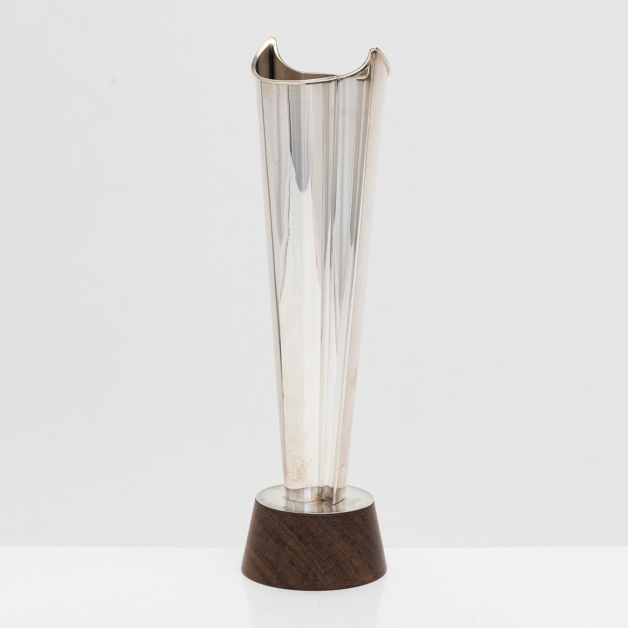 Tapio Wirkkala, a 'Liekki' (Flame) silver vase on a rosewood base, model TW 228, Kultakeskus, Hämeenlinna 1963.