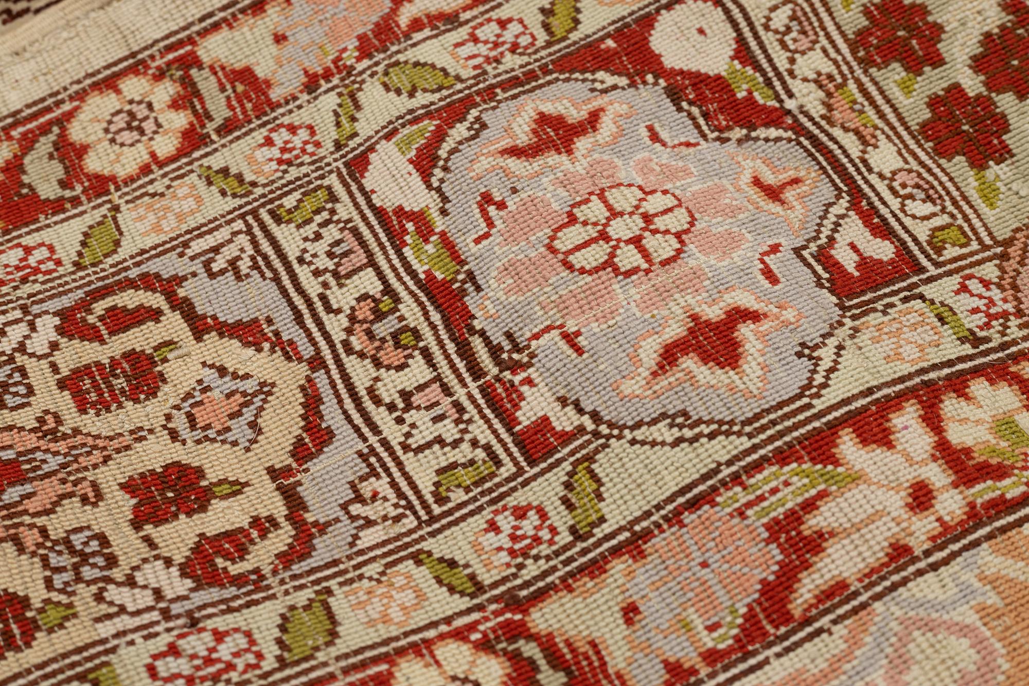 A rug, Old silk Hereke, ca 152 x 110 cm.