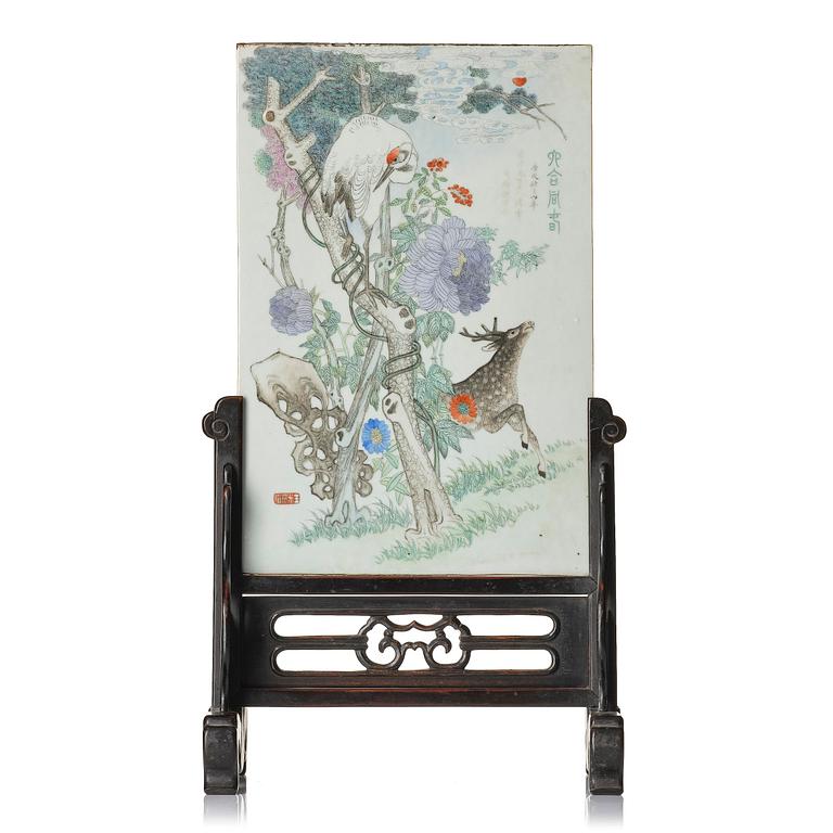A Chinese famille rose porcelain table screen with hardwood stand, 20th century.