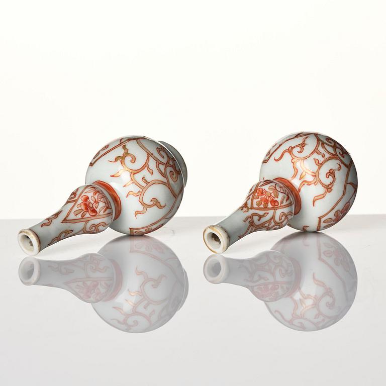 A set of three iron-red decorated water droppers, Qing dynasty, Kangxi (1662-1722).