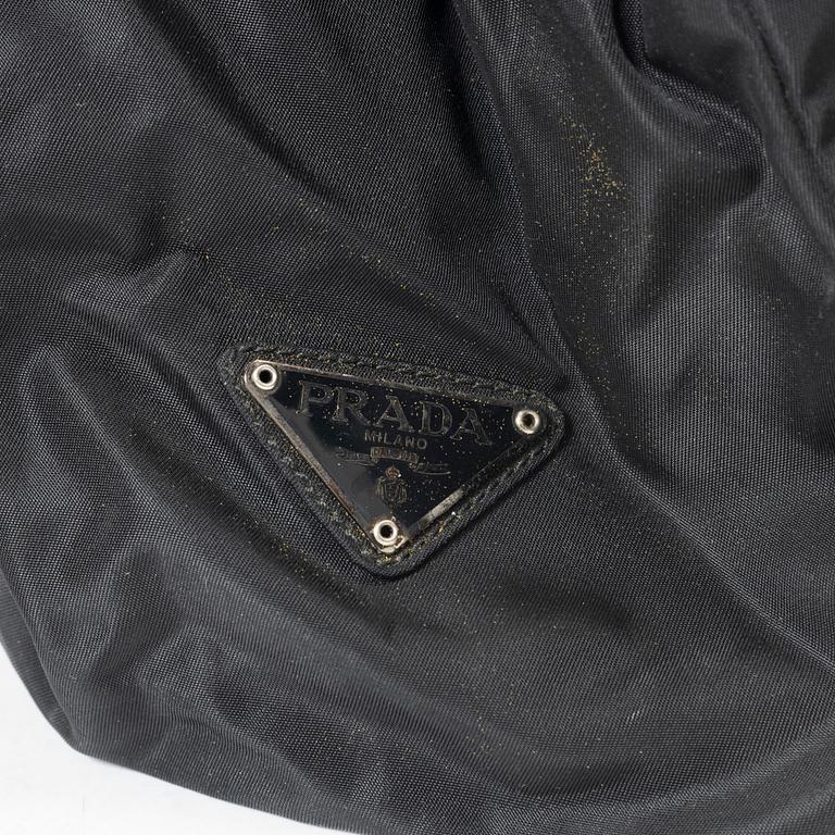 Prada, A nylon and leather backpack.