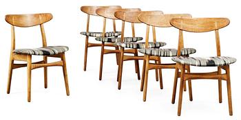 26. A set of six Hans J Wegner CH-30 oak and teak chairs by Carl Hansen, Denmark.