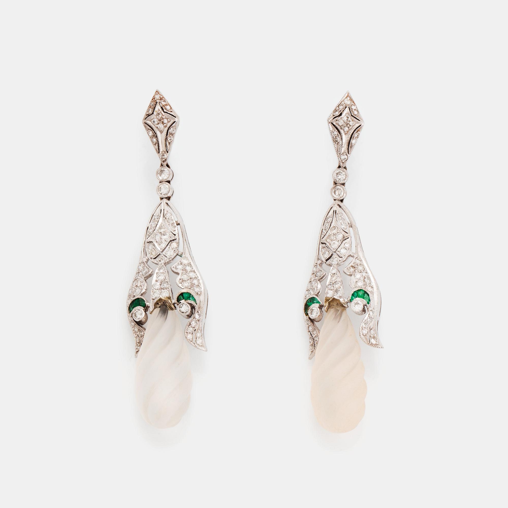 A pair of 18K white gold earrings with rock crystal drops.