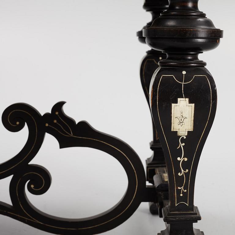 A Renaissance-style ebony, ebonized and ivory-inlaid library table, late 19th century, presumably Germany.