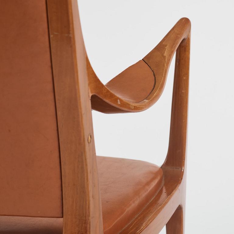 Hans Asplund, a walnut and leather easy chair, Nordiska Kompaniet, ca 1955, for the Nordiska Kompaniet beauty salon.