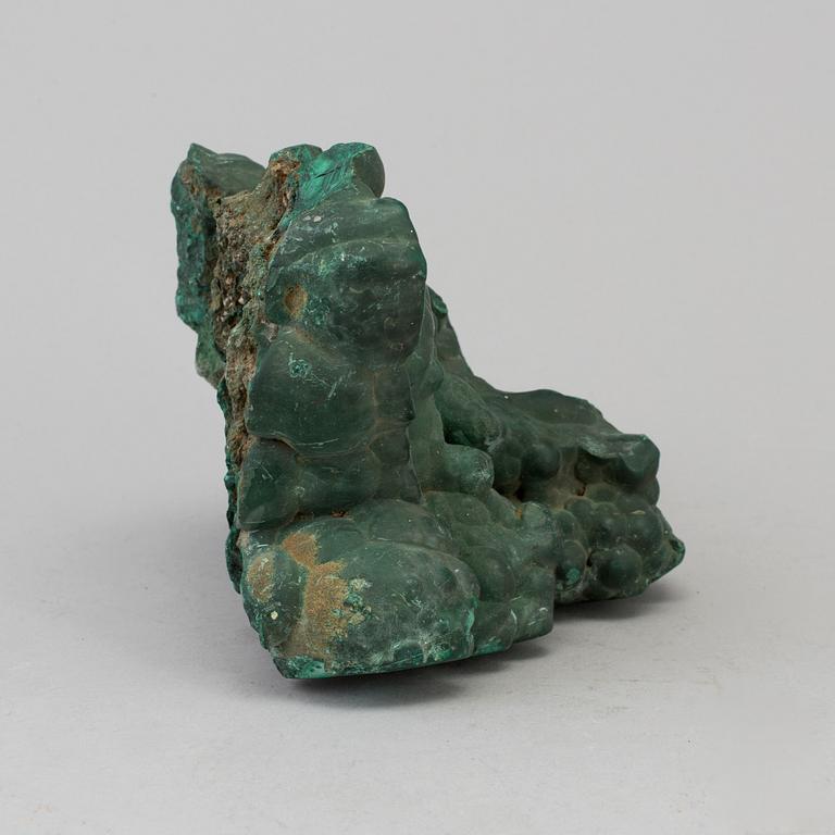 A malachite weight circa 1760 grams.