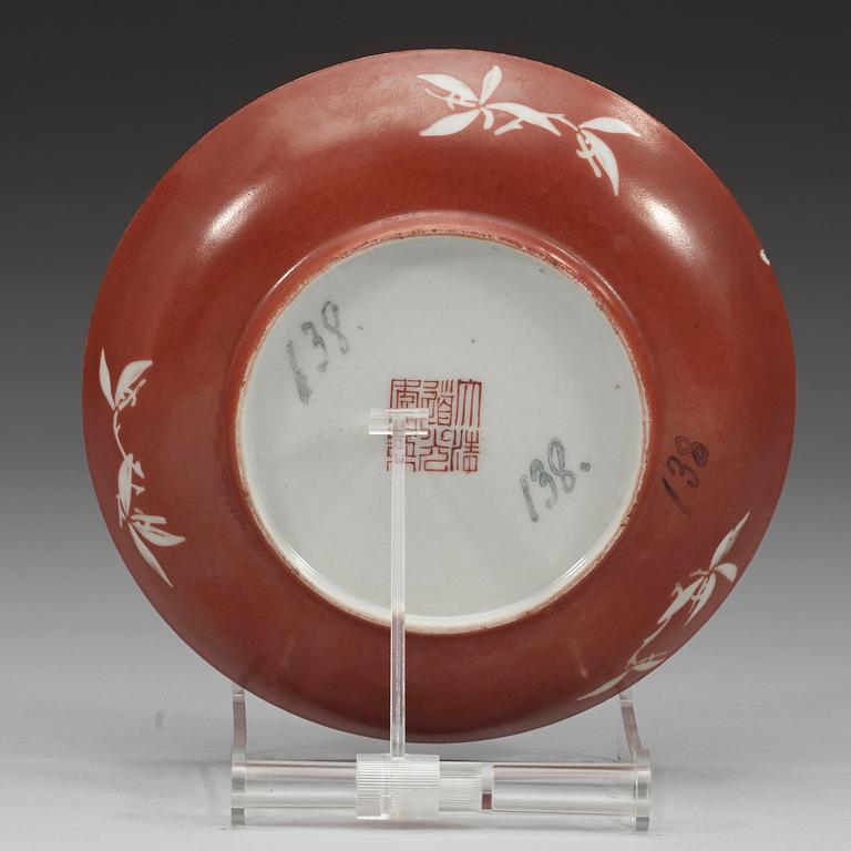An enamelled coral-gorund dish, Qing dynasty with Daoguangs seal mark and period (1821-1850).