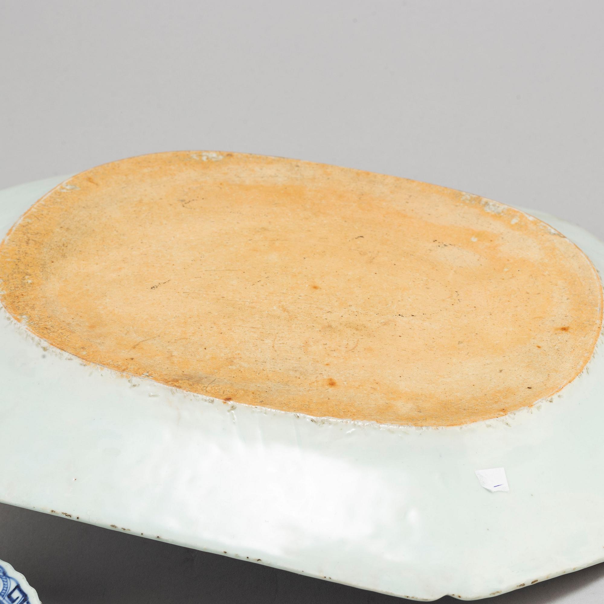 A blue and white export serving dish and a pair of plates, Qing dynasty, Qianlong (1736-95).