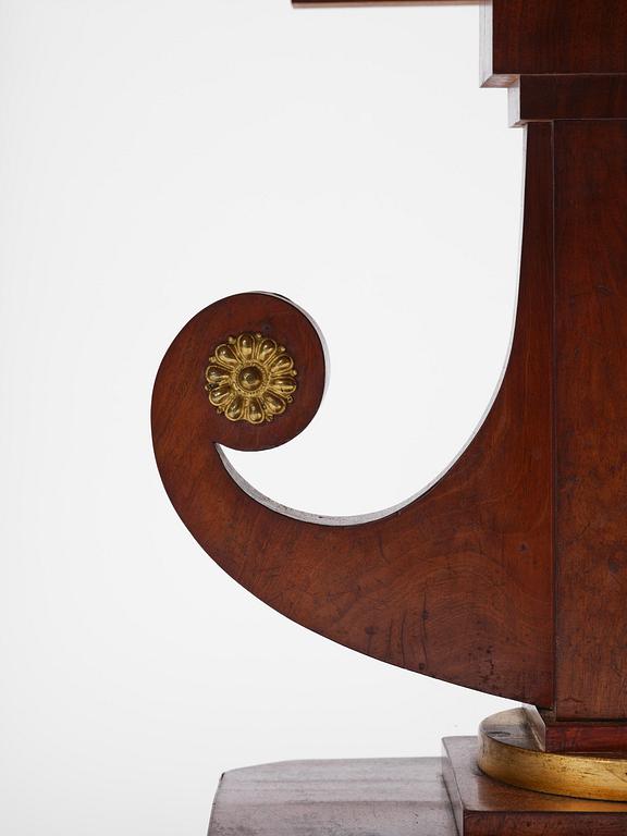 A Swedish Empire mahogany center table.