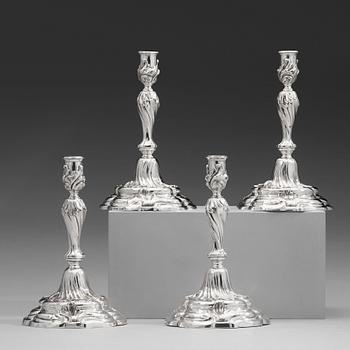 101. Two pairs of Swedish 19th and 20th century silver candlesticks, mark of Mollenborg and Jensen, Stockholm 1857 and 1936.