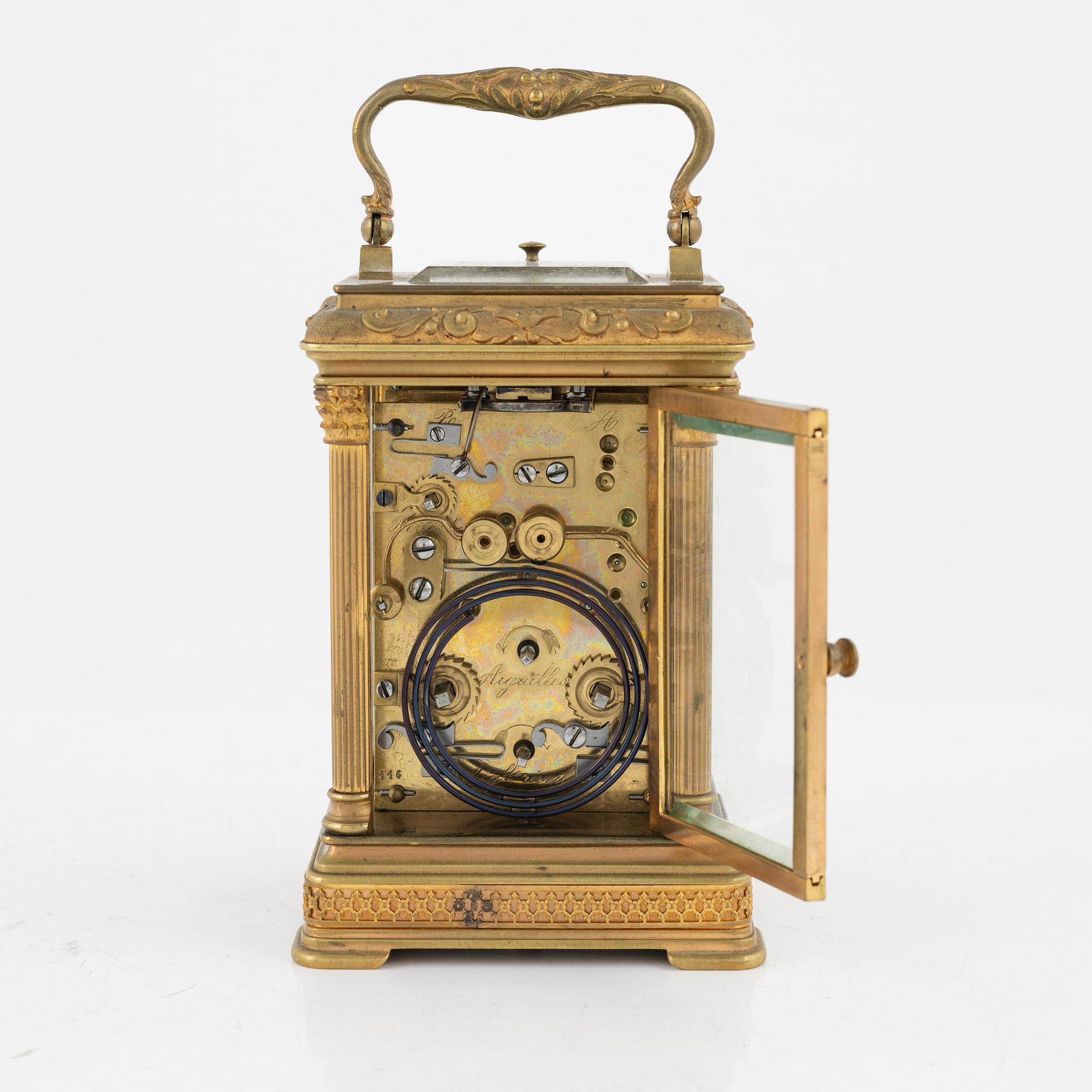 A French Brass and Glass Aiguilles Carriage Clock with Leather Case, first half of the 20th century.
