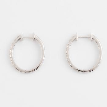 Brilliant cut diamond hoop earrings.