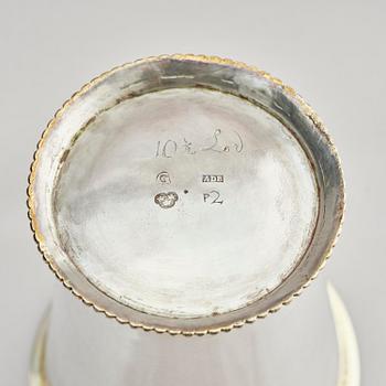 Three Swedish 18th century parcel-gilt silver beakers and a case of birch, different maker's.