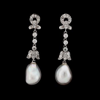 845. A pair of baroque pearl, possibly natural, and diamond earrings.