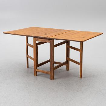 A gate-leg table, around 1900.