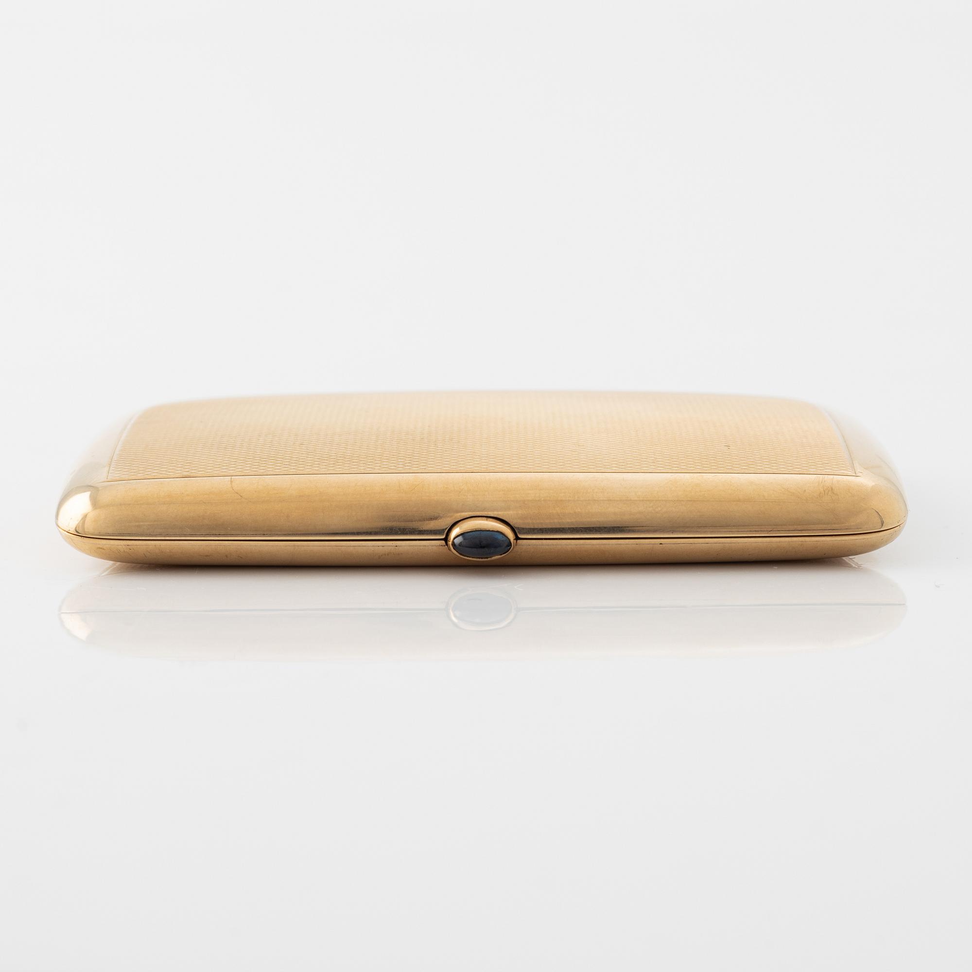 A 14 carat gold cigarette case.