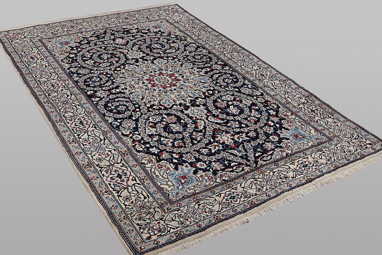 A carpet, Nain, part silk, 9 Laa, ca 295 x 197 cm.