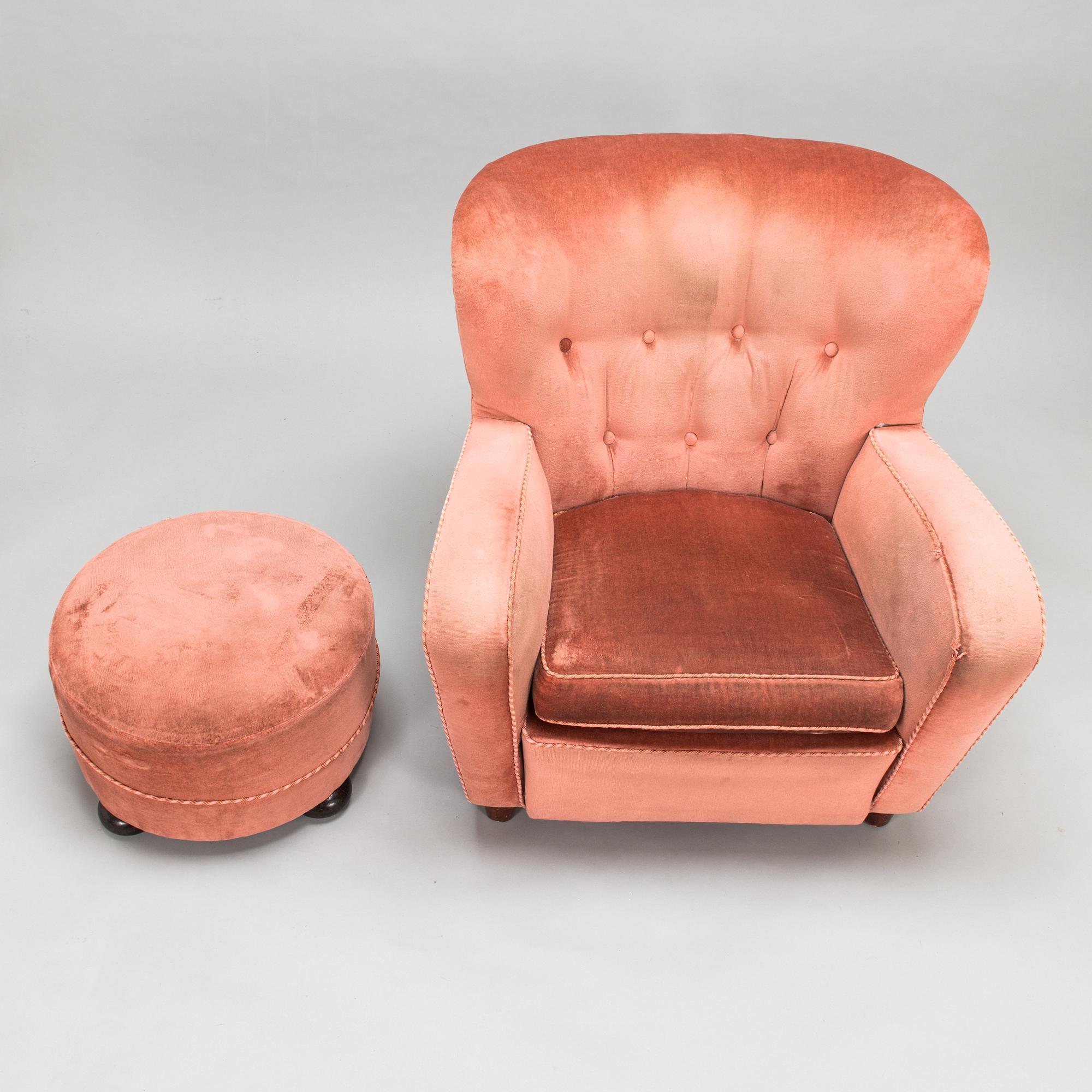 A mid-20th century armchair and ottoman.