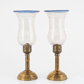 A pair of brass and glass presumably Russian hurricane lamps, later part of the 19th century.