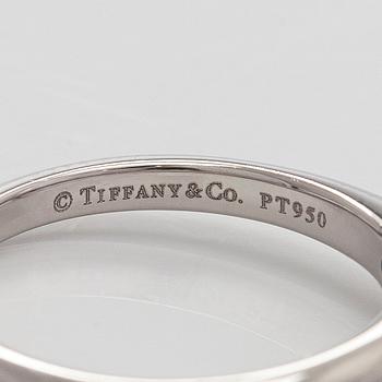 Tiffany & Co, a platinum solitaire ring with a brilliant-cut diamond.