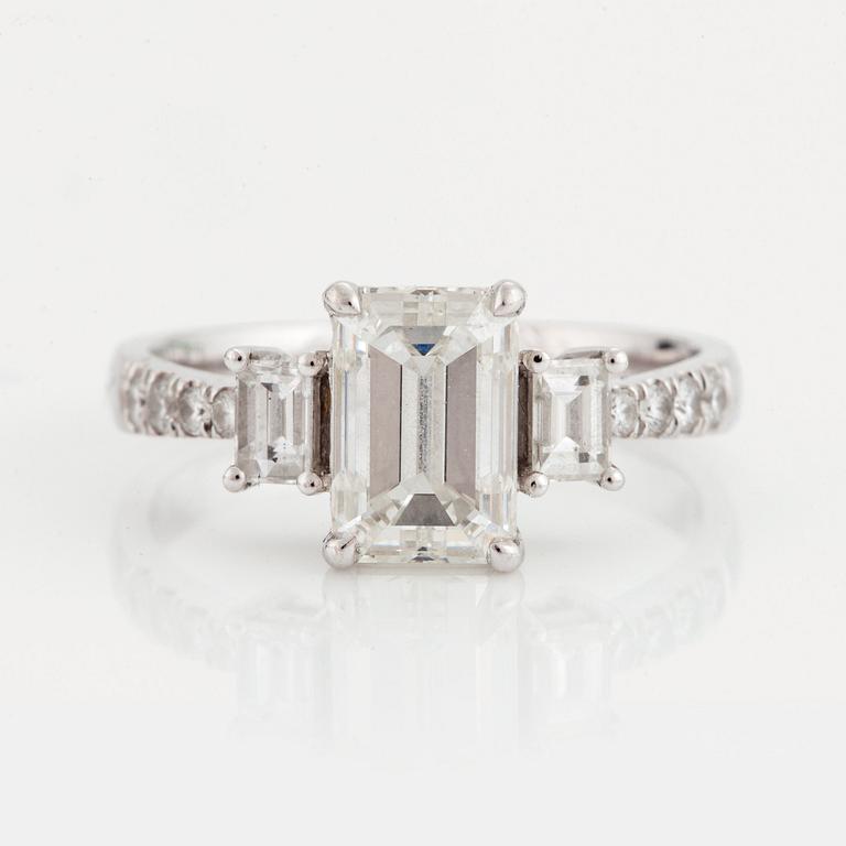 A RING set with an emerald-cut diamond.