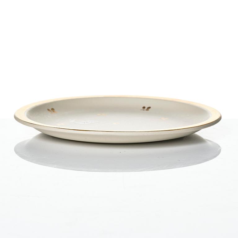 Wilhelm Kåge, 15 pieces of "Carrara" and "Gold Carrara" stoneware dishes, Gustavsberg, Sweden, 1930s/40s.
