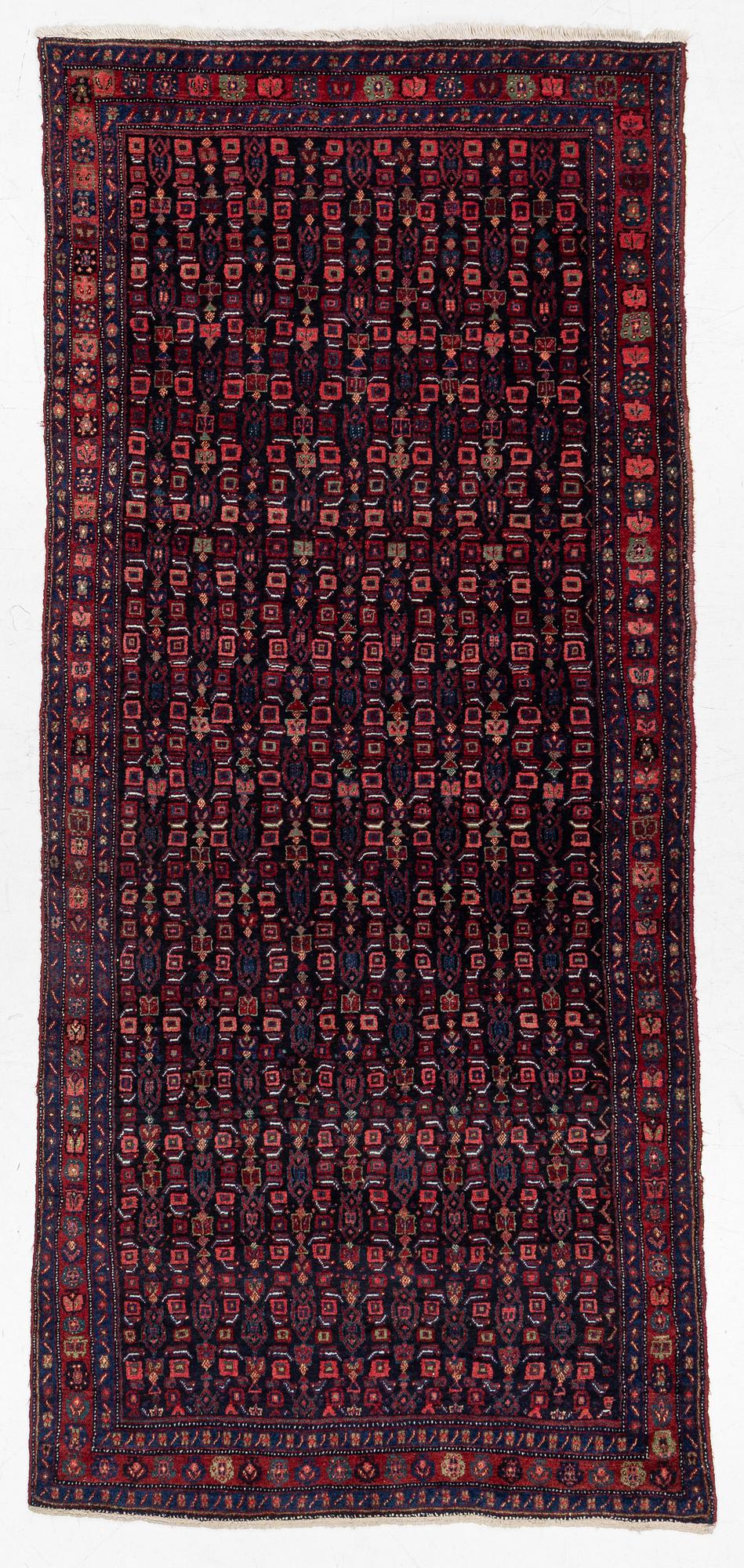 A semi-antique Bidjar carpet, c. 310 x 145 cm.