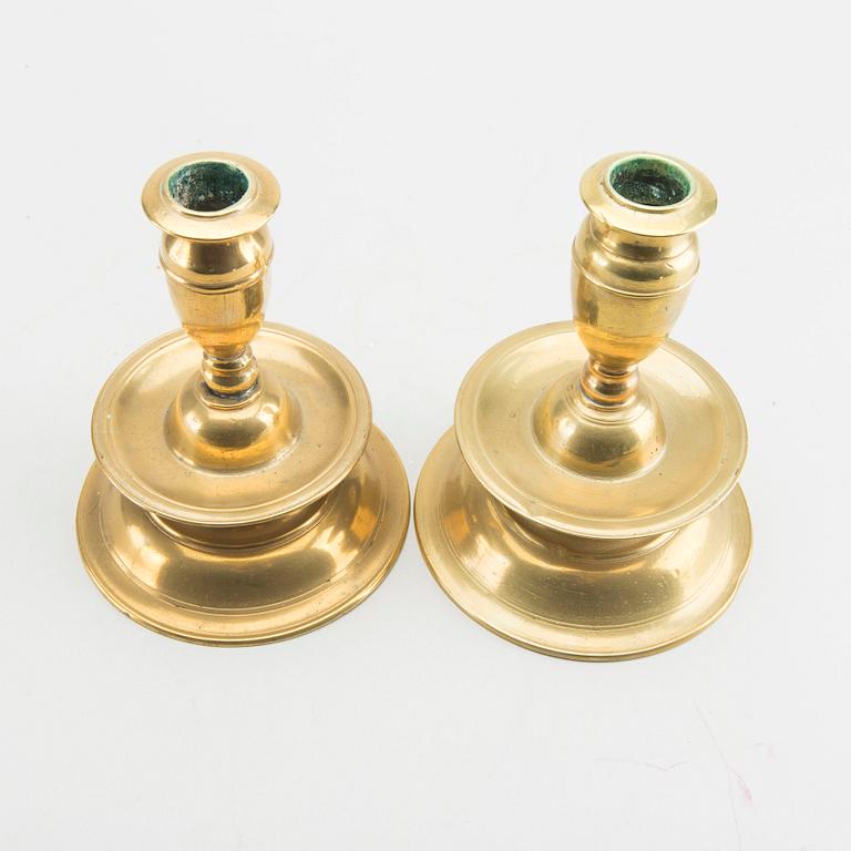 A set of two late Baroque brass candelsticks.