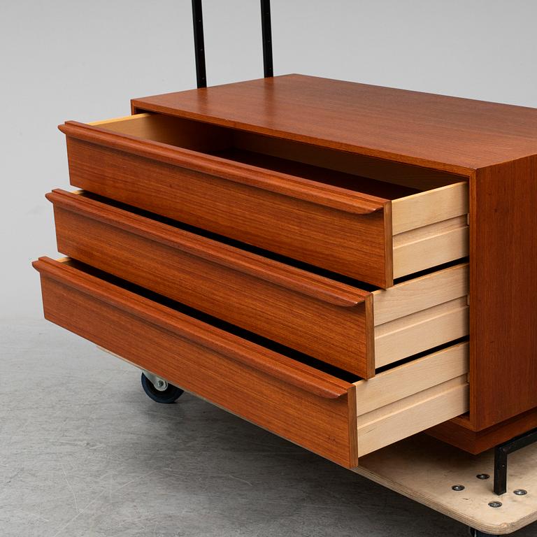 A teak shelf and drawers.